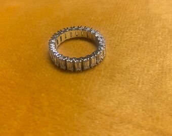 Size 5 eternity band featuring beautiful rectangule cut CZ stones stamped 925