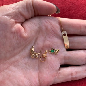 Vintage baby charms and baby bracelet in 14 karat gold (sold separately)