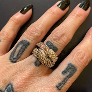 Size 7 Never worn two toned chocolate colored diamonds and topaz stones in a ribbon design sterling silver band