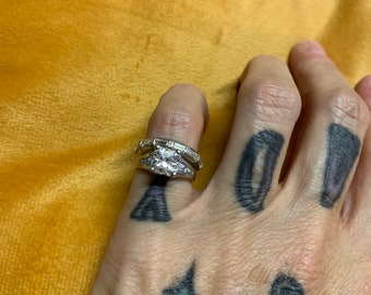 Beautiful size 5 wedding set featuring a square cut center stone baguettes on the shoulder and baguette cuts on band stamped 925