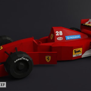 May include: A red, white and black Formula One race car with the number 28 on the side. The car has sponsors' logos, including Pioneer and Magneti Marelli. The car is made of paper and is a model.