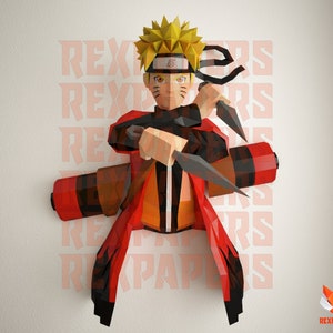 Könnte beinhalten: Ein 3D-Papiermodell von Naruto Uzumaki aus der Anime-Serie Naruto. Das Modell besteht aus rotem, orangem und gelbem Papier und zeigt Narutos charakteristisches Stirnband und Kunai.