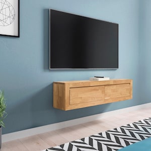 K&ouml;nnte beinhalten: Ein schwebendes Regal aus hellem Holz mit zwei Schubladen, montiert an einer blauen Wand unter einem Flachbildfernseher.