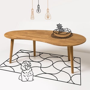 May include: A light wood coffee table with a unique, wavy shape. The table is sitting on a black and white patterned rug. A small, white dog is sitting in front of the table.