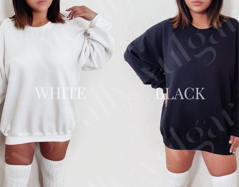 May include: Two oversized sweatshirts, one white and one black, with a crew neck and long sleeves. The sweatshirts are shown on models wearing white knee-high socks.