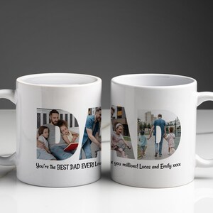 Puede incluir: Dos tazas de cer&aacute;mica blanca con la palabra "DAD" en letras grandes, cada una llena de fotos familiares. Una taza dice "You're the BEST DAD EVER!" y la otra dice "Love you millions!"