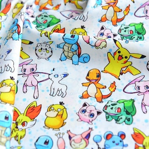 May include: White fabric with a repeating pattern of colourful cartoon characters. The design includes various creatures in shades of yellow, blue, green, pink, and orange. The fabric has a soft, slightly textured appearance.