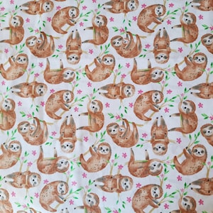 May include: A white fabric with a repeating pattern of brown sloths hanging from branches with pink flowers. The sloths are in various poses, some are sleeping, some are hanging upside down, and some are holding onto branches.