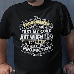 May include: A black t-shirt with a white graphic design that reads "PROGRAMMER I DON'T ALWAYS TEST MY CODE BUT WHEN I DO I PREFER TO DO IT IN PRODUCTION".