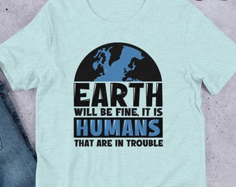May include: A light blue t-shirt with a graphic of a blue and black earth with the text "Earth will be fine, it is humans that are in trouble".