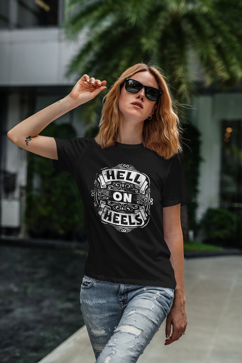 May include: A black t-shirt with a white graphic that says "Hell on Wheels".
