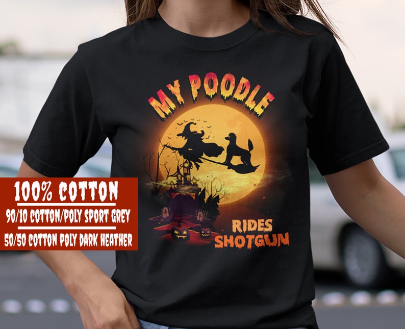 May include: Black t-shirt with a graphic of a poodle riding a broomstick with a witch. The text "My Poodle Rides Shotgun" is printed on the shirt.
