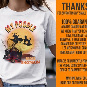May include: White t-shirt with a graphic of a witch riding a broomstick with a poodle. The text "My Poodle Rides Shotgun" is printed on the shirt.