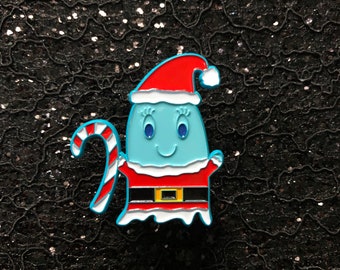 May include: A blue ghost wearing a red and white Santa hat and a red and white Santa suit with a candy cane in its hand.