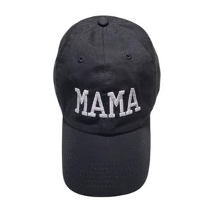 May include: A black baseball cap with a white embroidered word "MAMA" on the front.