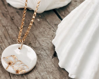 Wildflower Stamped Gold Necklace on a White Porcelain Pendant and 14K Gold Filled Dainty Chain. Nature Lover Gift, Minimal Gold Jewellery.