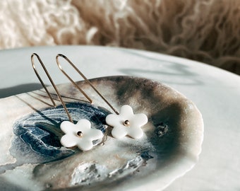 Dainty white flower drop earrings with 14k gold filled dangles and porcelain daisy charm