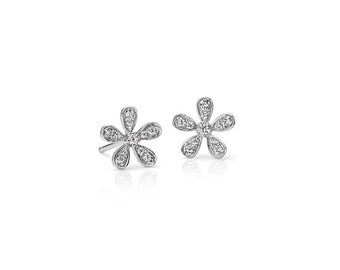 May include: A pair of silver flower-shaped stud earrings with clear cubic zirconia stones.