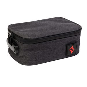 May include: A rectangular charcoal grey storage case with a textured fabric exterior, featuring a black zip closure with an integrated combination lock on the side and a small square black patch with a red geometric logo on the front corner.