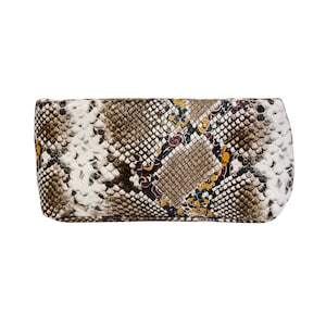 May include: A small, rectangular clutch bag with a snakeskin pattern in shades of brown, white, yellow, and blue. The bag has a subtle floral design.