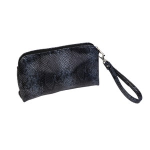 May include: A black snakeskin-patterned zippered pouch with a black strap.