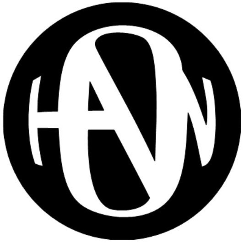May include: Black and white monogram logo with the letters "HAW" in a circle.