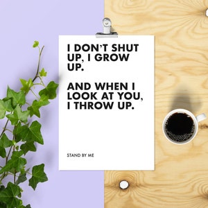 May include: A white card with black text that reads "I don't shut up, I grow up. And when I look at you, I throw up." The card also has the text "Stand By Me" at the bottom.