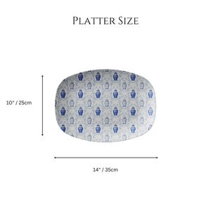 May include: Oval platter with a blue and white floral pattern. The platter is 14 inches (35cm) long and 10 inches (25cm) wide. The text "PLATTER SIZE" is at the top.