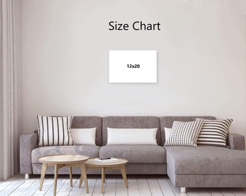 Puede incluir: Un lienzo blanco con el texto "Size Chart" y "12x20" en una pared. El lienzo est&aacute; encima de un sof&aacute; seccional gris con cojines decorativos y dos mesas de centro de madera.