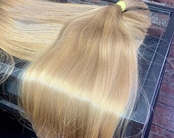 Exclusive in this length! 21 inches 120g of pure gold, virgin unprocessed kids hair, natural light blonde with shiny honey hue touch