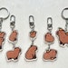 see more listings in the Keychains/Charms section