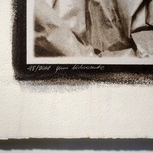 May include: A black and white photograph of crumpled fabric. The image is numbered 48/2014 and signed "Jean Bil&eacute;venede".