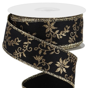 May include: A roll of black ribbon with gold floral embroidery and gold trim. The ribbon is spooled on a white cardboard core. The decorative ribbon is suitable for gift wrapping, crafting, and holiday decorations.