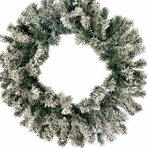 May include: A circular wreath constructed from artificial evergreen branches. The needles are a deep forest green color, and the tips of the branches are coated in a thick, white, textured flocking material that mimics the appearance of fresh snow.