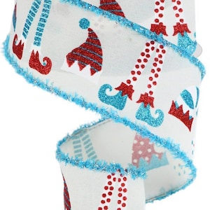May include: White ribbon with a repeating pattern of red and blue elf hats and feet. The ribbon has a blue glitter trim and is rolled on a white spool. The design is festive and suitable for holiday crafts.