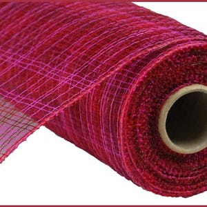 May include: A roll of red deco mesh with a woven, open weave pattern. The mesh transitions from a deep red to a lighter pink hue. The roll is wrapped around a cardboard tube, showcasing the texture and color variations.