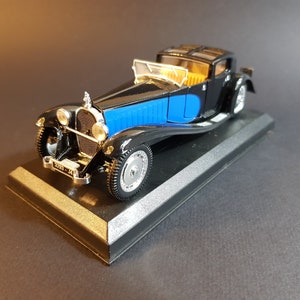 1:43,Norev,Bugatti,Royale 1928 bi-colore avec ouvrants dans sa boite vitrine et suboite carton collection Voitures d'Exception