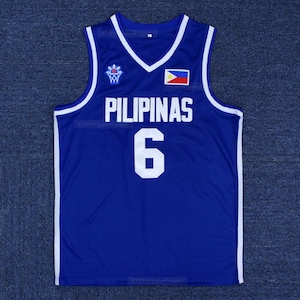 May include: A royal blue basketball jersey featuring white trim on the V-neck and armholes. The front displays the word PILIPINAS in white block letters above the number 6, a small Philippine flag, and a white basketball hoop graphic logo.