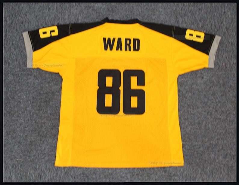 May include: Yellow football jersey with black and grey trim. The back of the jersey has the name "WARD" and the number "86" in black.