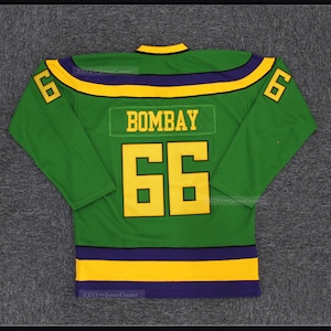 May include: Green hockey jersey with purple and yellow stripes. The back of the jersey has the name "BOMBAY" and the number "66" in yellow.