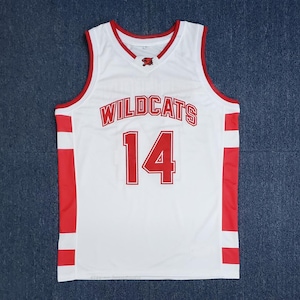 May include: White basketball jersey with red accents and the word "WILDCATS" in red block letters across the chest. The number "14" is also in red. The jersey has a V-neck and red trim.