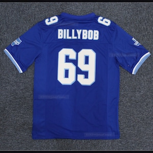May include: Blue football jersey with white numbers and the name "BILLYBOB" on the back. The jersey has a light blue trim around the collar and sleeves.