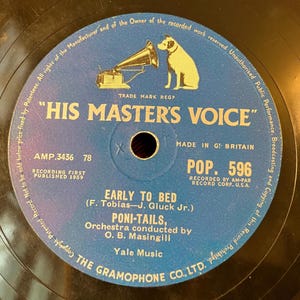 May include: A vintage vinyl record with a blue label featuring the text "HIS MASTER'S VOICE" and a logo of a gramophone and dog. The record includes the song "EARLY TO BED" by PONI-TAILS, recorded in 1959.
