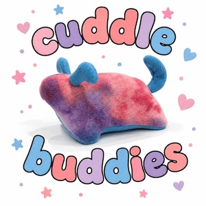 May include: A plush animal toy with a tie-dye pattern in shades of pink, purple, and blue. The toy has blue ears and a blue tail. The text 'cuddle buddies' appears in large, colorful, bubble-style letters above and below the plush toy.