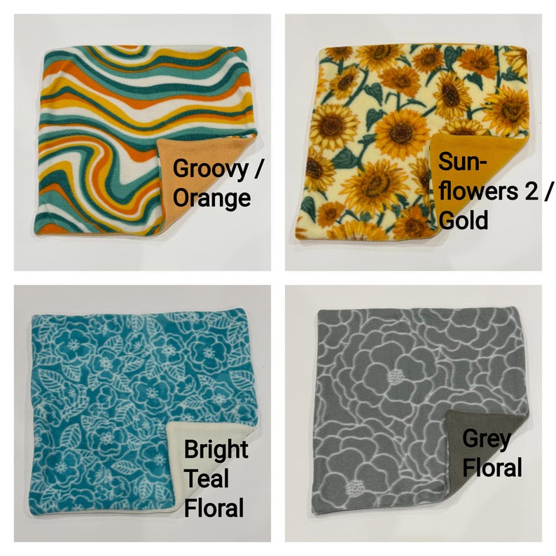May include: Four square fabric swatches featuring distinct patterns: a wavy orange, teal, and white print; a yellow sunflower print; a teal floral print; and a gray floral print. Each swatch shows a solid-colored backing in orange, gold, cream, or gray.