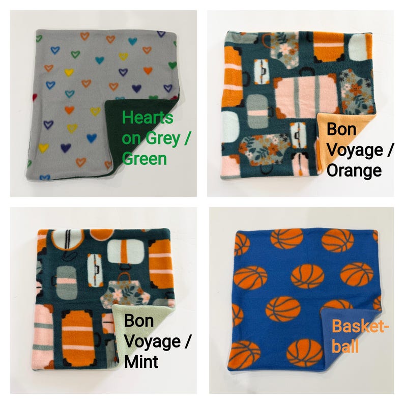 May include: Four square fleece fabric swatches. Top left: grey with multicolored hearts and dark green backing. Top right: travel luggage print with orange backing. Bottom left: travel luggage print with mint backing. Bottom right: blue with orange basketballs.