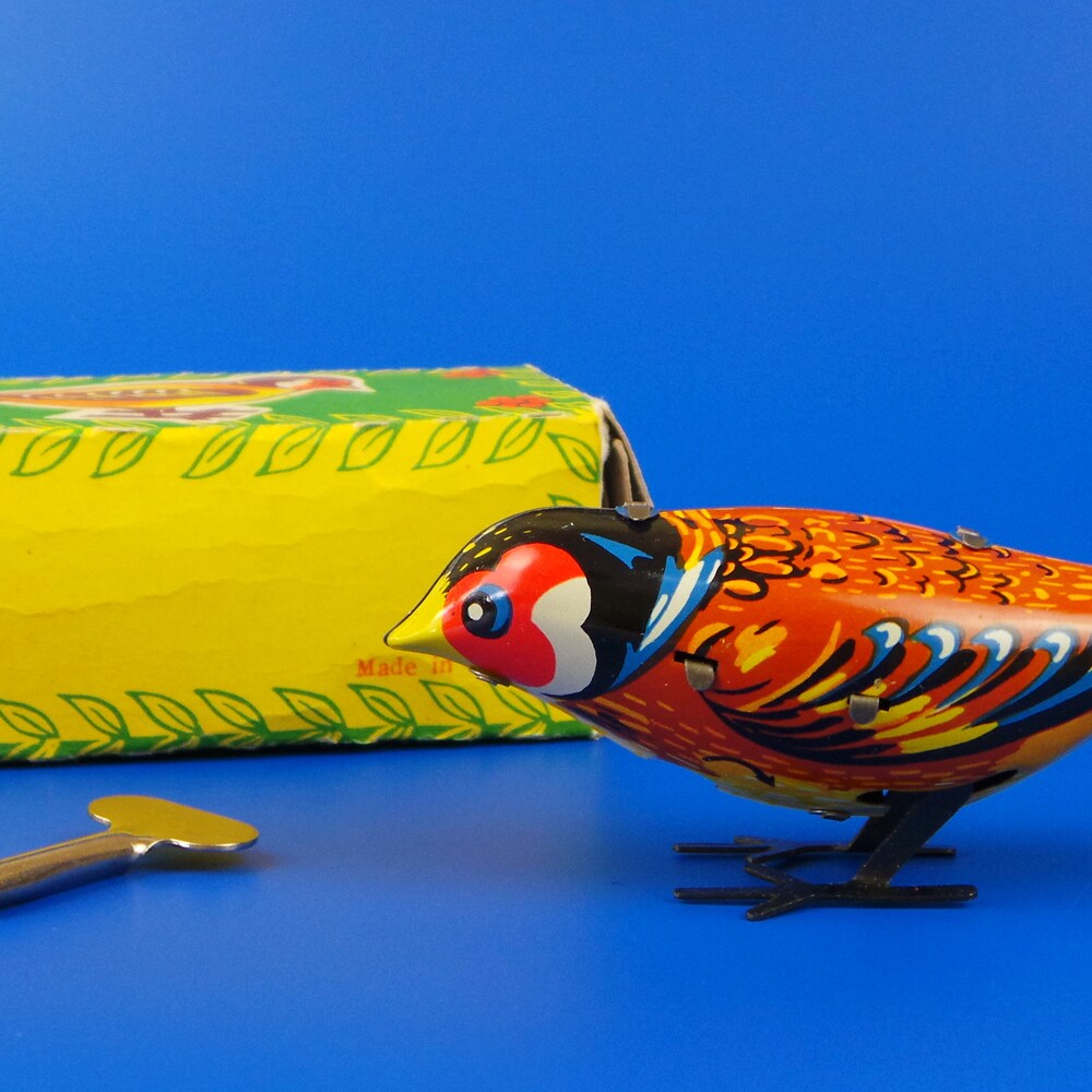 Antique mechanical pecking bird toy