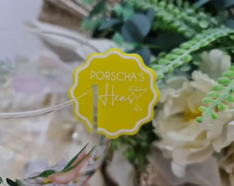 May include: Yellow circular paper drink stirrer with the text "Porscha's Hens" and a cocktail glass icon.
