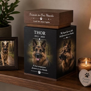 May include: A square wooden pet memorial urn with a dark finish, featuring a photo of a German Shepherd, the name THOR, dates 2012-2025, and the text Forever in Our Hearts, Until We Meet Again, A true companion forever in our hearts, No longer by our side.