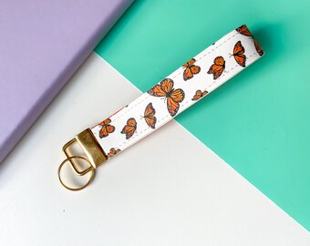 White & Orange Monarch Butterfly Print Faux Leather Wristlet, Key Fob, Keychain